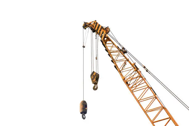 Photo of Close-up industrial big crane with steel hook for work on construction building outdoor site, isolated on white background