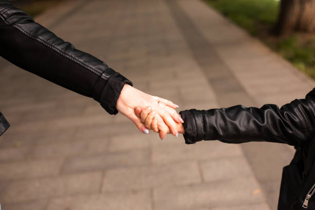 istock Midsection Of Man Holding Hands On Footpath 1331137304