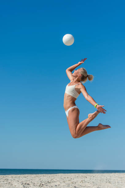 istock Man Jumping In Sea Against Clear Blue Sky 1331137652