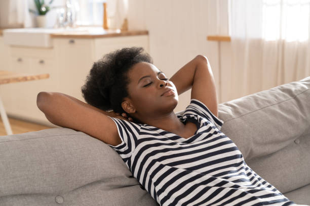 istock Young Woman Relaxing On Sofa At Home 1331142102