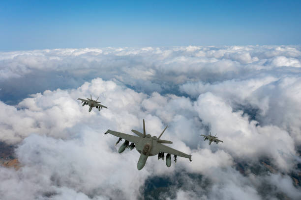 istock Jet fighters flying over the clouds. 1331144174