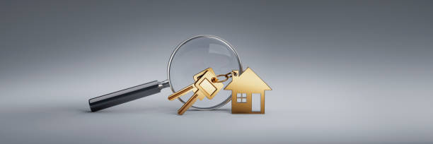 House shaped key ring with magnifying glass Golden toy or symbol house with key ring and magnifying glas - large copy space house key photos stock pictures, royalty-free photos & images