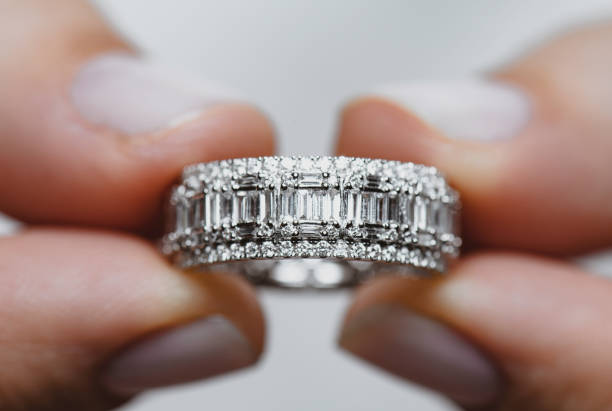 istock Woman Holding A Diamond Ring 1331148183