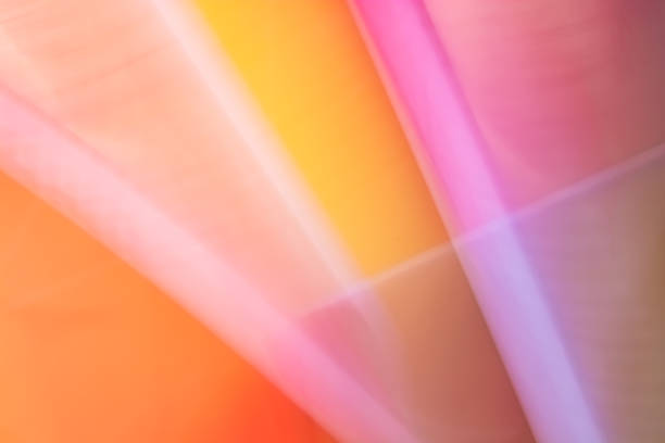 Abstract pink orange yellow gradient background with lines and curls of surface.