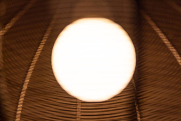 istock Defucsed low angle close up shot of a glowing light bulb. 1331151040