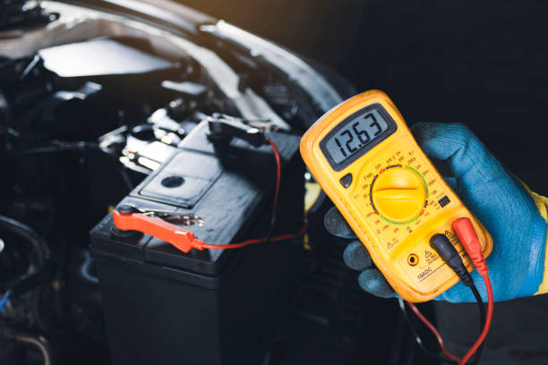 istock Mechanic checking car battery voltage with digital multimeter 1331153270