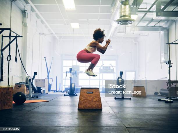 Woman In A Cross Training Gym Stock Photo - Download Image Now - Exercising, Cross Training, Jumping