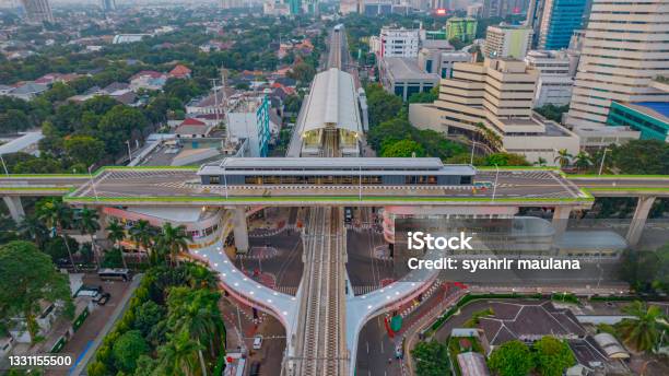 Aerial View Of Articulated City Buses Arriving And Leaving At Bus Station Near Main Railway Station Stock Photo - Download Image Now