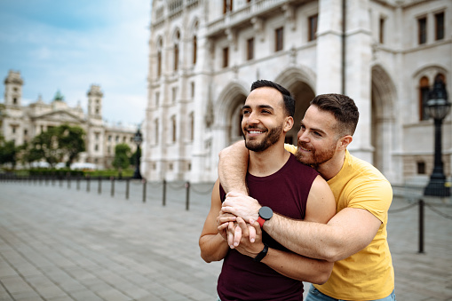 Gay couple enjoying city break in Europe