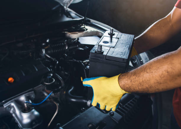 istock Technician replaced new car battery 1331155810