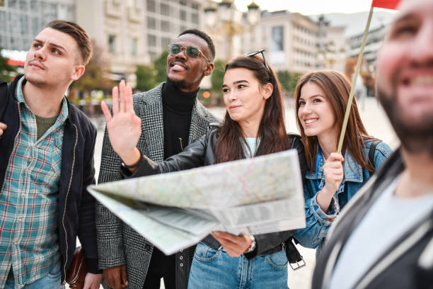 istock Female With Map Telling Friends About Location On Map 1331160451