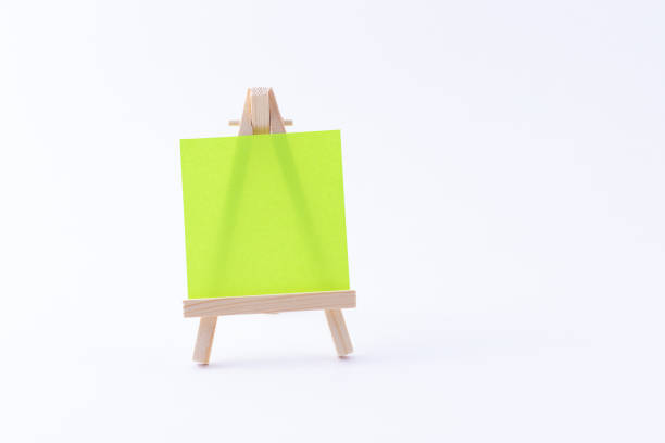 istock Wooden Easel Miniature with Blank Colored Square Canvas or Memo Paper 1331164698