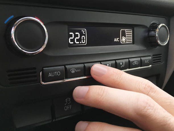 istock Adjusting the car air conditioner 1331165437