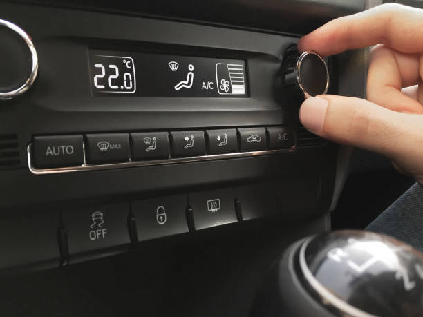 istock Adjusting the car air conditioner 1331165493