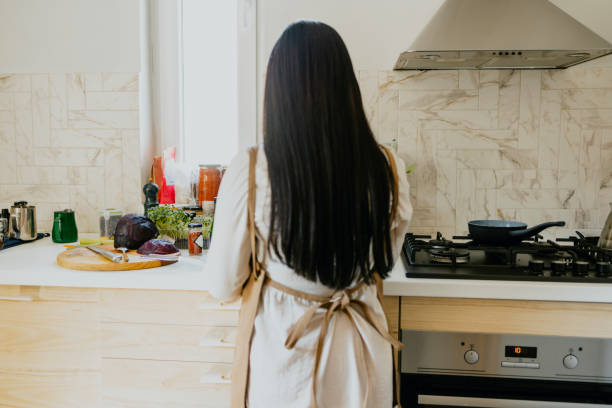 istock Anonymous Female Chef Preparing a Tasty Meal in the Kitchen 1331171137