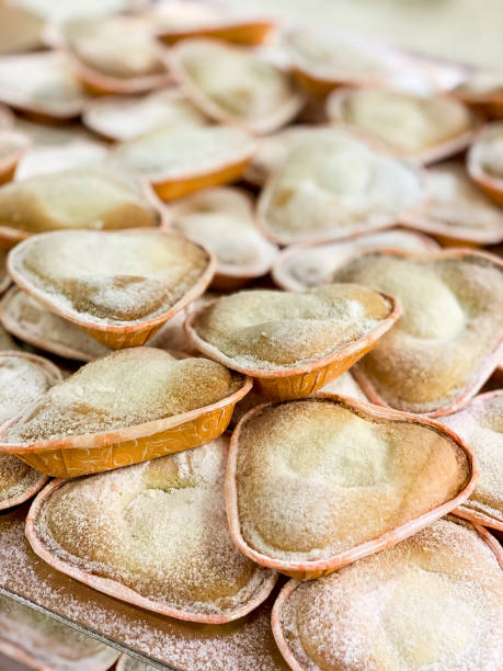 istock Vanilla heart pastries in baking cups, baking liners 1331171645