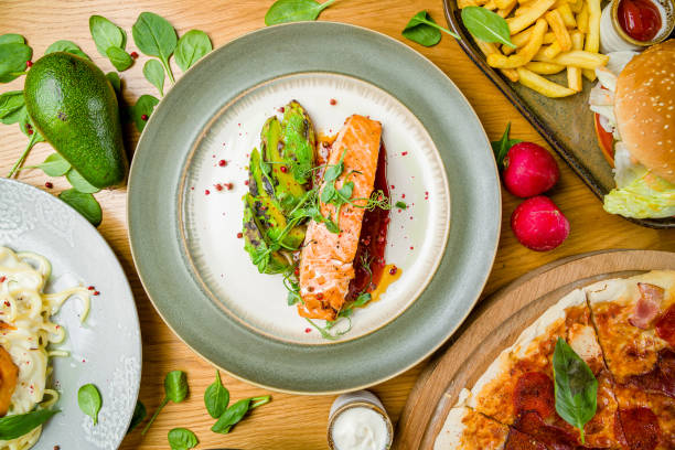 istock Salmon steak on the grill with avocado on plate on dark concrete table top view 1331175207