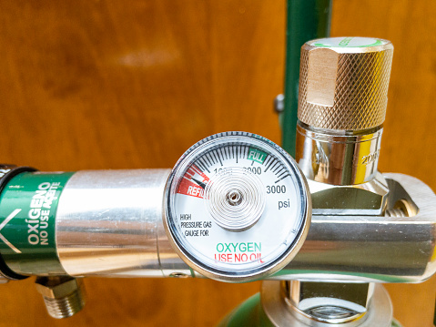 Close up of the gauge indicating empty portable medical oxygen tank