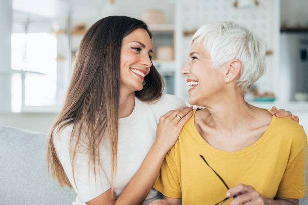 Mother and daughter Modern senior woman and her adult daughter happy together mother in law stock pictures, royalty-free photos & images