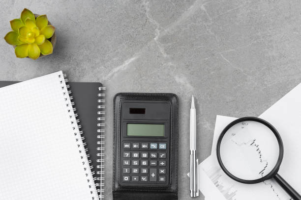 istock Spiral notebook with calculator on office desk 1331179342