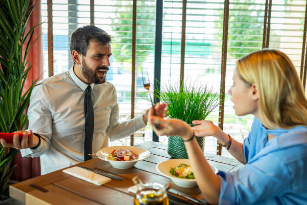 istock Beautiful Fashionable Couple in Love is Going Through Serious Relationship Problems During the Lunch at a Restaurant. 1331179538