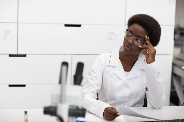 istock Scientist african american woman working in laboratory with electronic instruments 1331184462