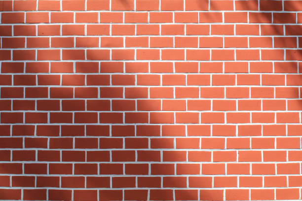 istock Red Urban Brick Wall in sunlight with beauty pattern and texture. Background With Copy Space. Creative Empty Template With Abstract Silhouettes at Sunset. 1331185815