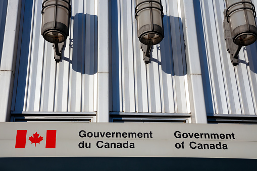 Government of Canada sign on downtown quebec french Gouvernement du Canada post office building lights