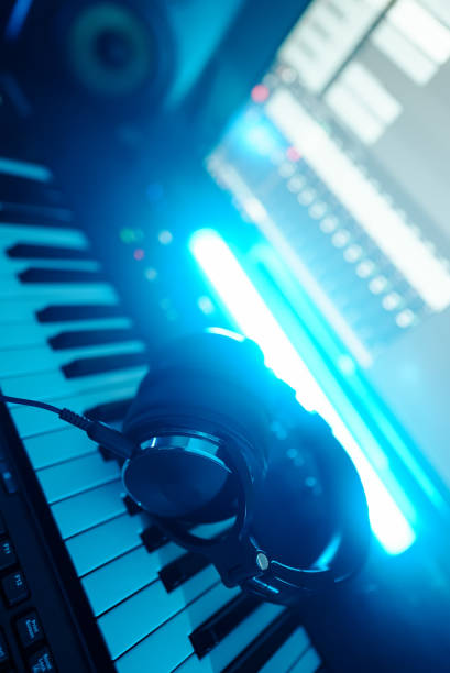 istock Headphones on the piano keyboard. Recording studio concept. 1331191771