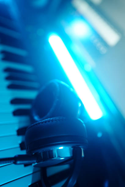 istock Headphones on the piano keyboard. Recording studio concept. 1331191773