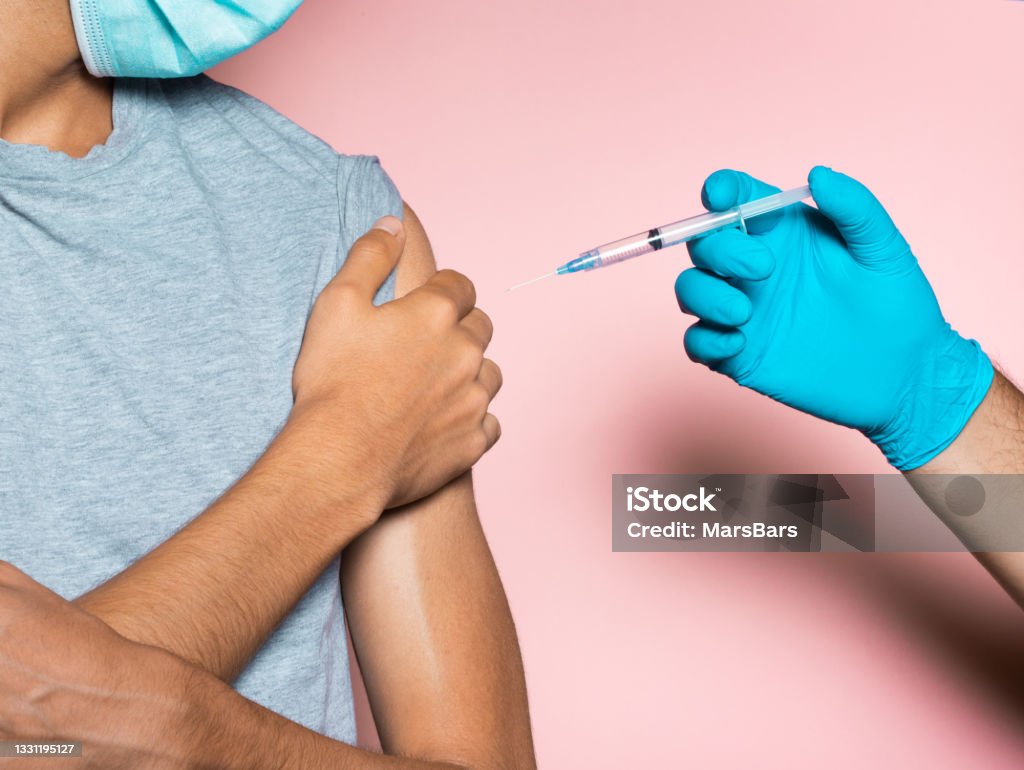 Young man refusing vaccine, anti vaccination concept Anti-vaccination Stock Photo