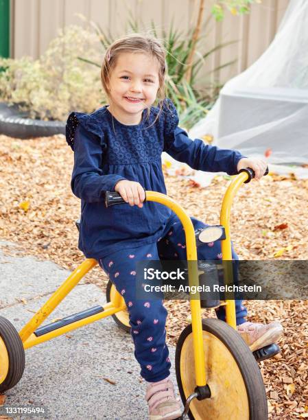 Small Child On Tricycle Stock Photo - Download Image Now - Childhood, Tricycle, Education