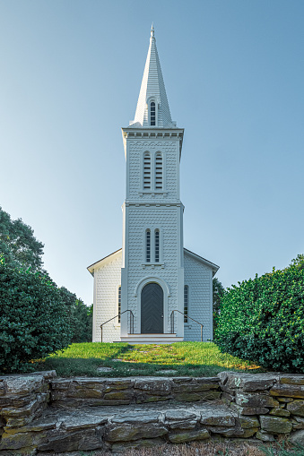 One of the finest examples of an early Victorian church, the South Ferry Church, is located 1000 feet from Narragansett Bay on a hilltop on South Ferry Road in Narragansett, Rhode Island. Designed by Thomas Tefft, a prominent 19th century Providence architect, the South Ferry Church was built in the 1850's for the Narragansett Baptist Church.