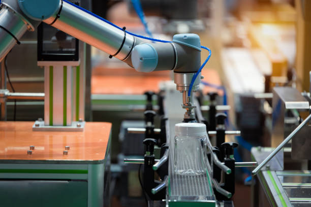 istock Robotic arm machine in factory picked up the Plastic bottle packaging for food 1331201005