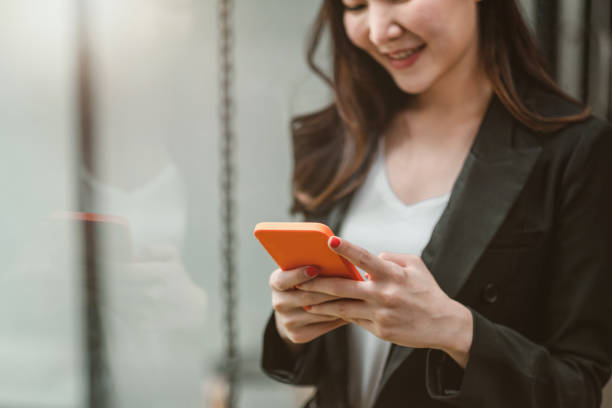 istock Business woman using smartphone shopping online, call, texting message internet technology lifestyle. Asian woman using cellphone at modern office 1331201156