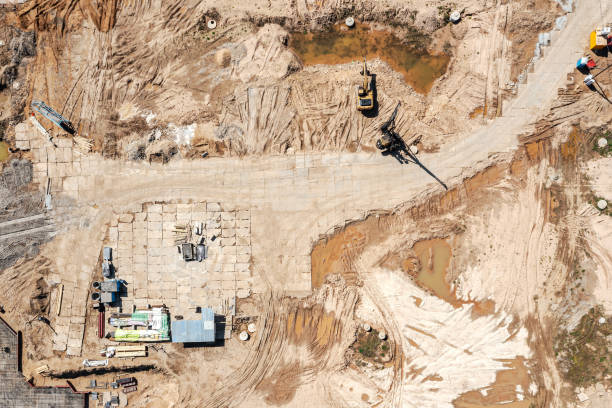 istock new construction site with heavy construction machines and materials. aerial top view. 1331201351