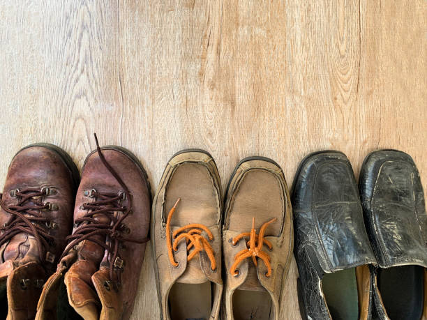 istock old leather shoes on wooden table background 1331203740