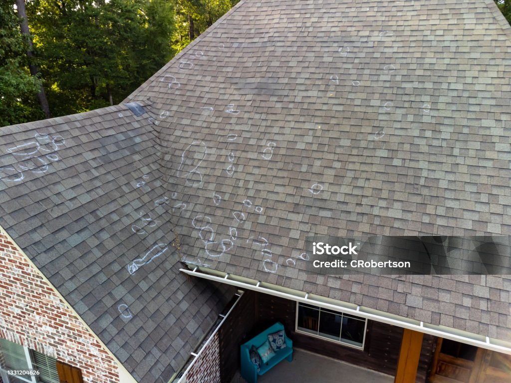 Roof with hail damage and markings from inspection Roo0f with hail damage and chalk markings from inspection Rooftop Stock Photo