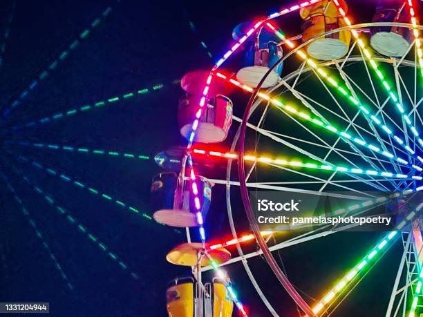 Vivid Vibrant Multicolored Lights Of Ferris Wheel At Stock Photo - Download Image Now