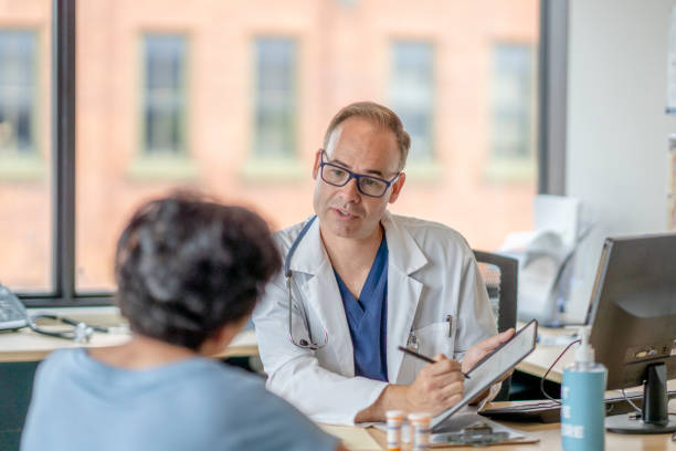 istock Woman consults her doctor 1331206816
