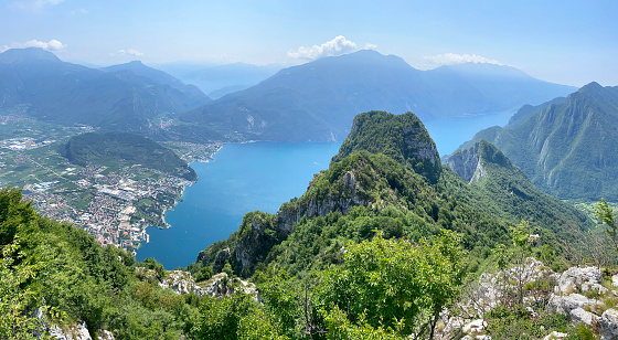 Riva del Garda seen from the top of the mountain. Monte Altissimo and Monte Baldo in background.