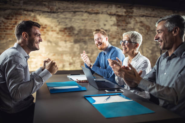 istock Happy HR team congratulating male candidate on successful job interview. 1331215294