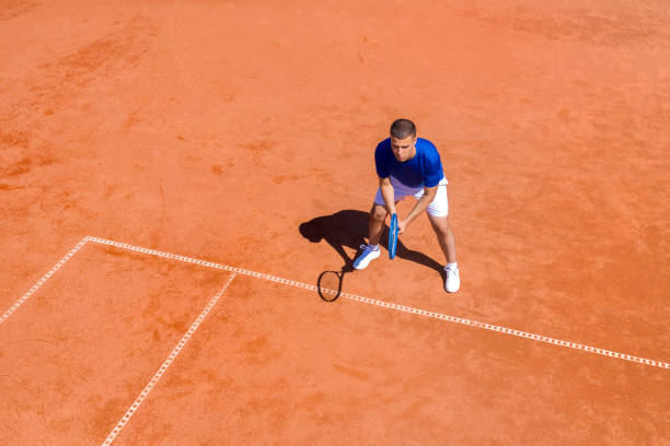 istock Young Tennis Player Waiting for the First Serve 1331224850