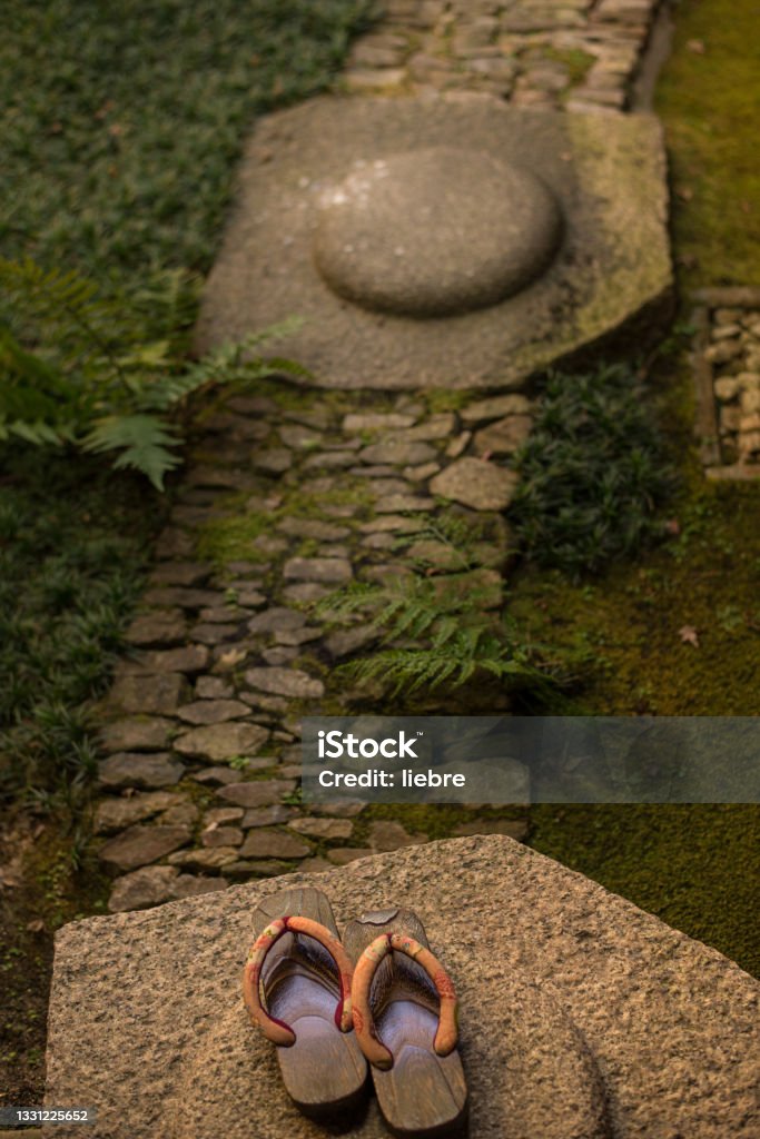 Japanese garden and Japanese clogs (geta) Japanese Garden Stock Photo