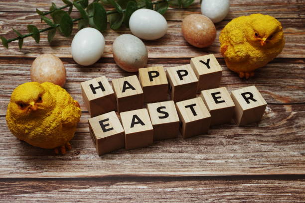 istock Happy Easter and easter eggs decoration on wooden background 1331228038