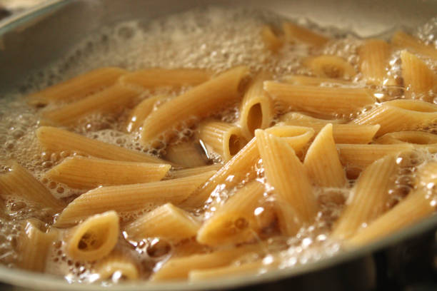 istock Cooking whole wheat pasta in the pot 1331229610