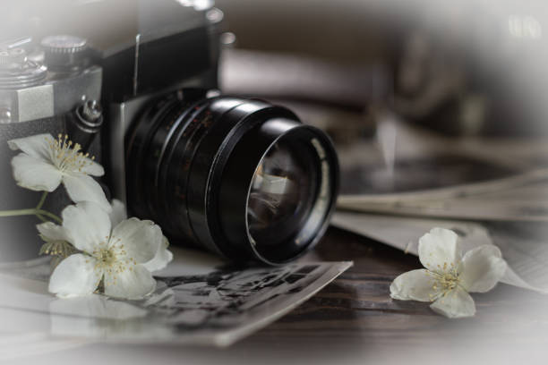 Old outdated camera and black and white photo in retro style