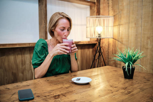 istock young woman drinking healthy smoothie 1331235919