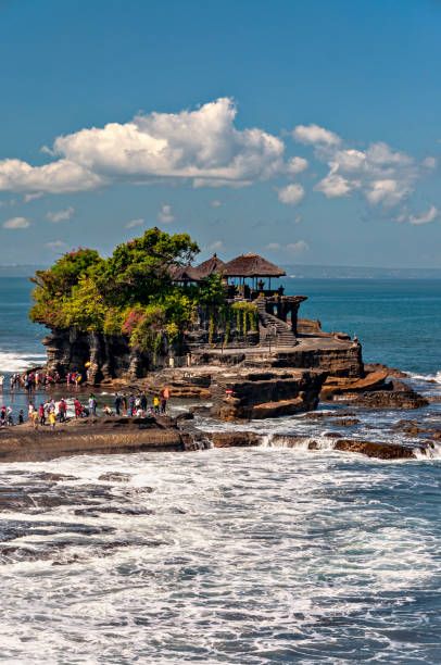 View of Tanah Lot and temple, Bali, Indonesia. May 9, 2014.  Tanah Lot temple, Bali, Indonesia.

Tanah Lot is an offshore rock formation in the southern coast of Bali. In the rock there's Pura Tanah Lot, a sacred hinduist temple. tanah lot temple bali indonesia stock pictures, royalty-free photos & images