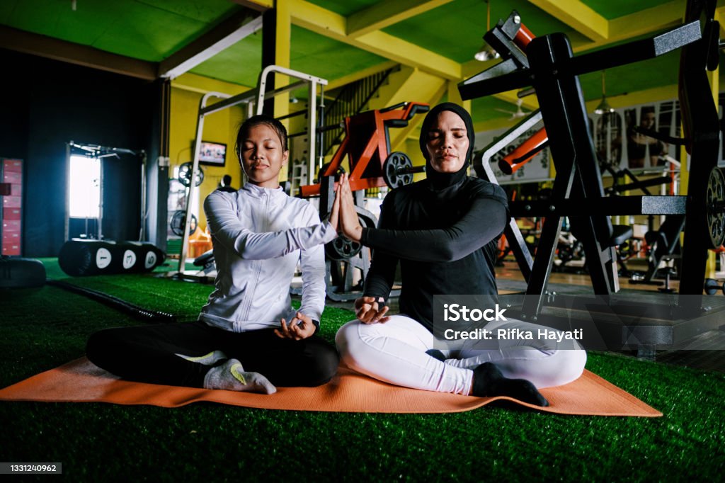 Mother and Daughter Yoga at Gym Working Out - Healthy Lifestyle #showUS Gym Stock Photo